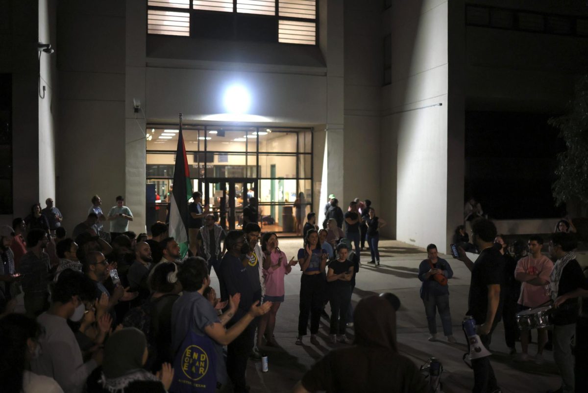 People gather in front of Travis County Jail after arrests were made on the University of Texas at Austin's campus Wednesday.