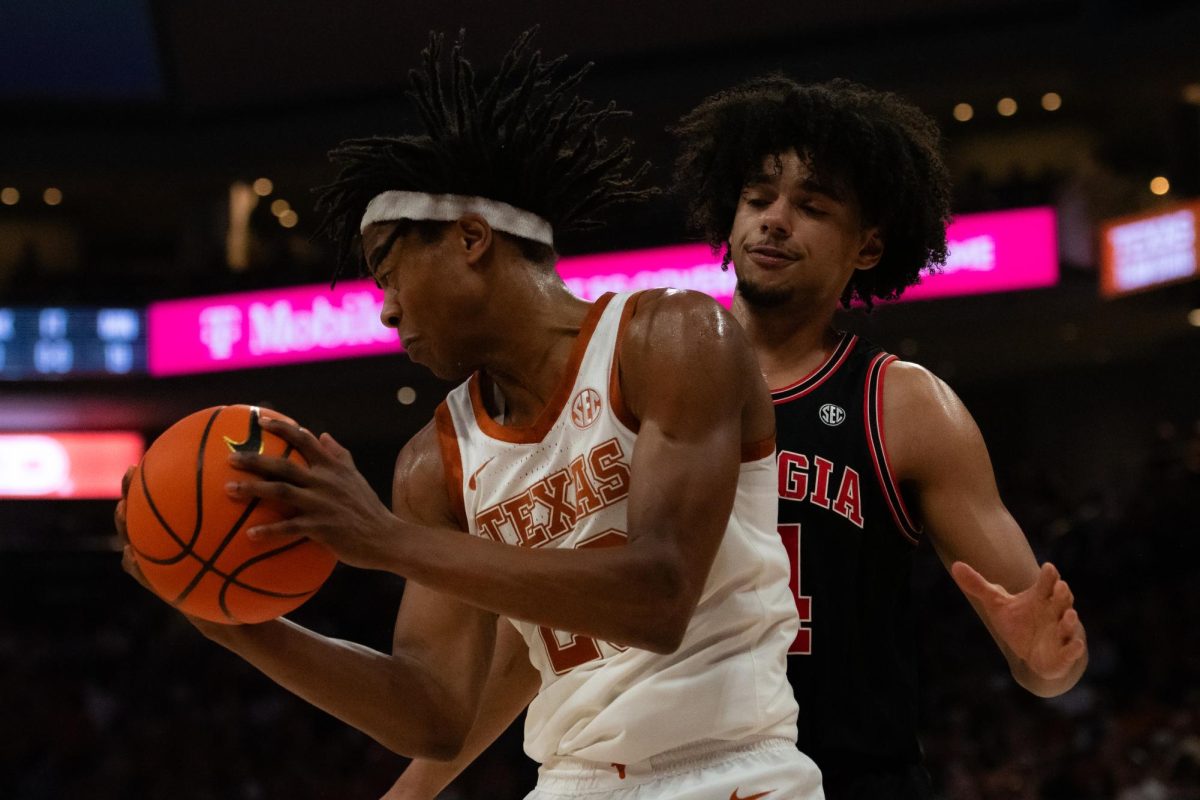 Freshman guard Tre Johnson attempts to pass the ball at the matchup against Georgia on March 1, 2025.