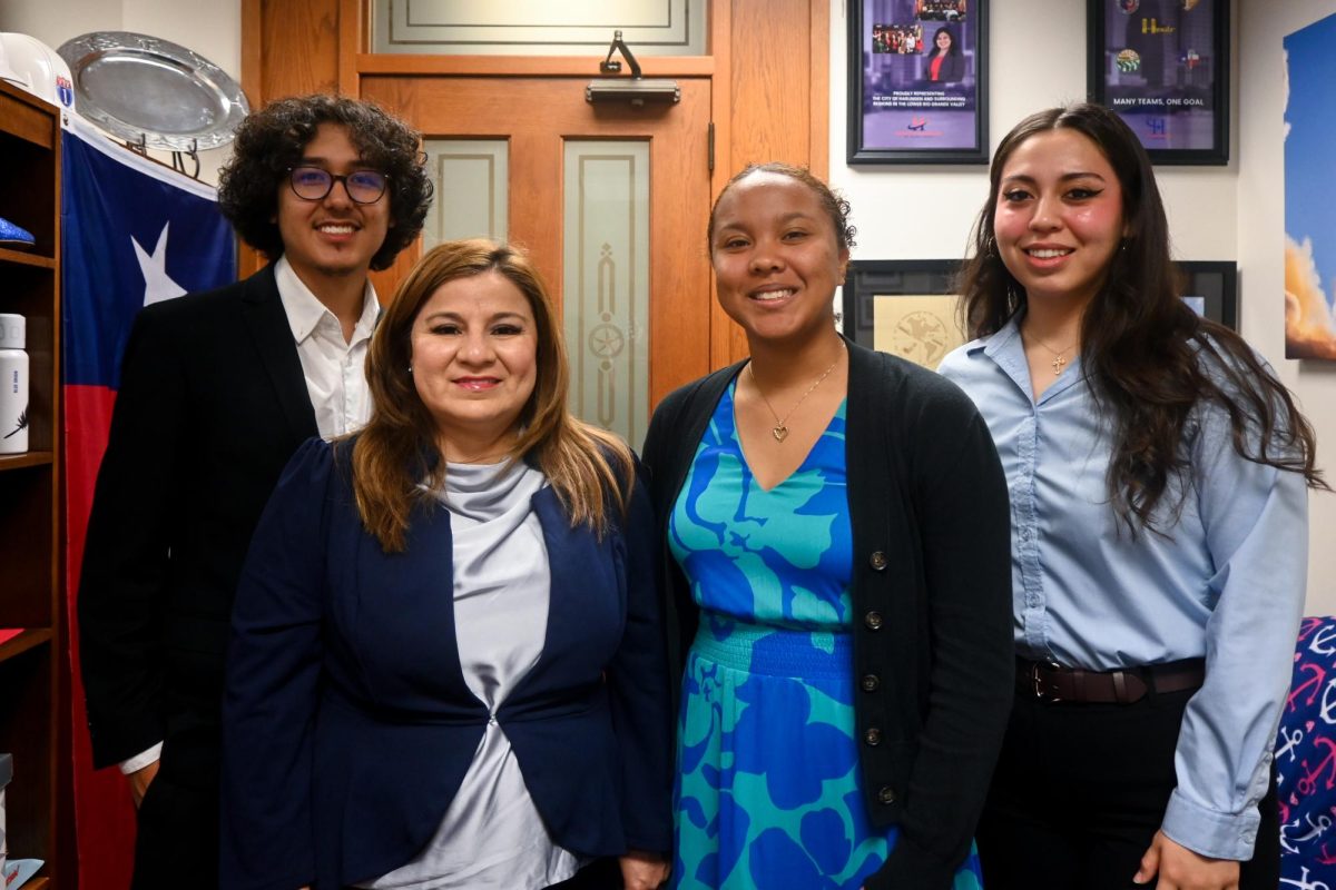 UT students Amy DonJuan, ArcAngel Lopez and Kiana Simpson stand for a picture with state Rep. Janie Lopez on April 22, 2025. 